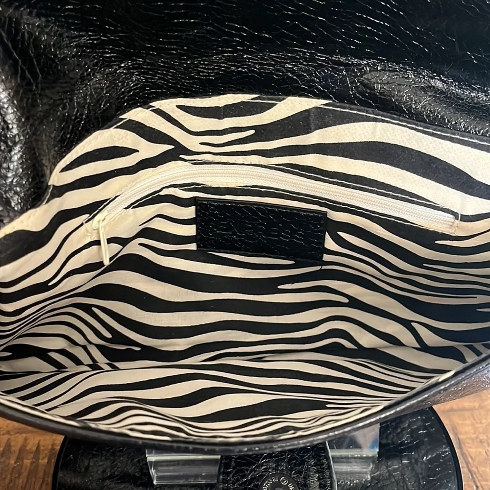 Express Black faux leather envelope clutch, with zebra pattern lining